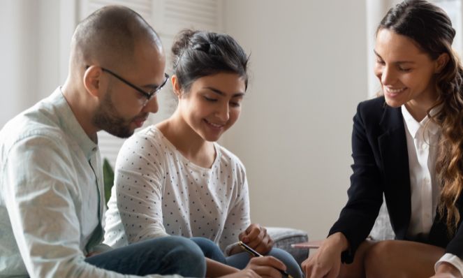 couple reads rental agreement